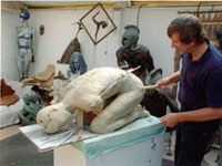  Len works without Hannah, smoothing down the clay in preparation to adding the arms.